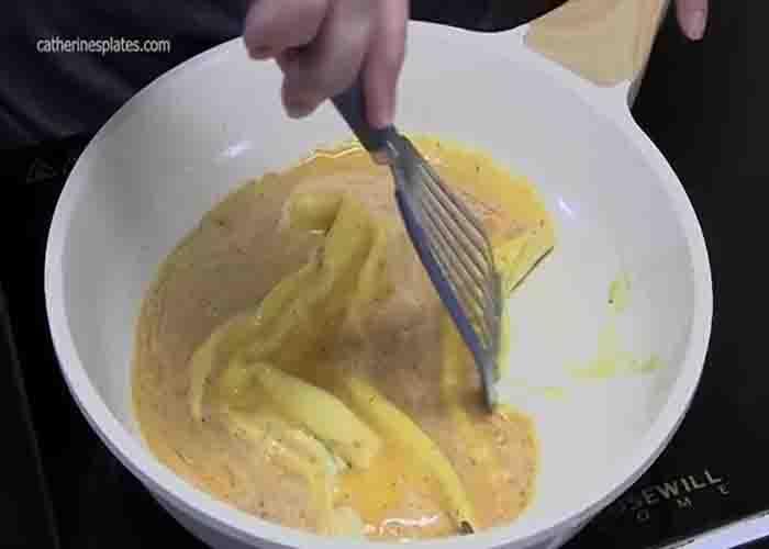 Frying the eggs to make denver omelet