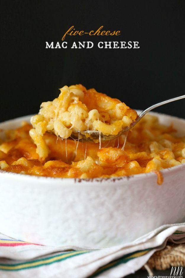 Typeset graphic reading five-cheese mac and cheese over a white bowl with a spoon pulling a long cheese stretch