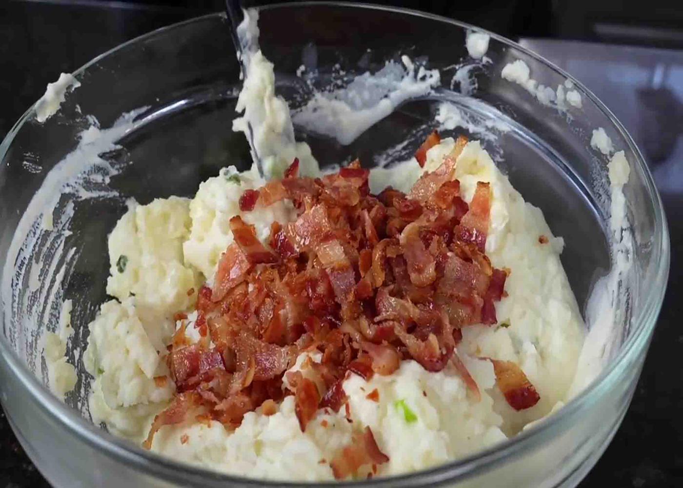 Mixing he ingredients for the baked potato casserole