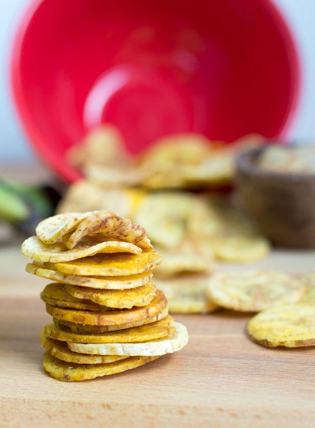 Baked plantain chips on parchment with a bowl of maple bacon paleo mayonnaise, a gluten free snack idea