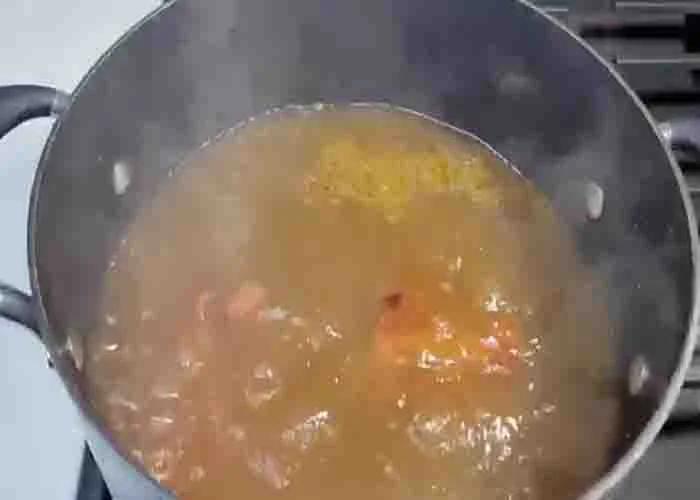 Simmering the turkey necks for the gumbo collard greens