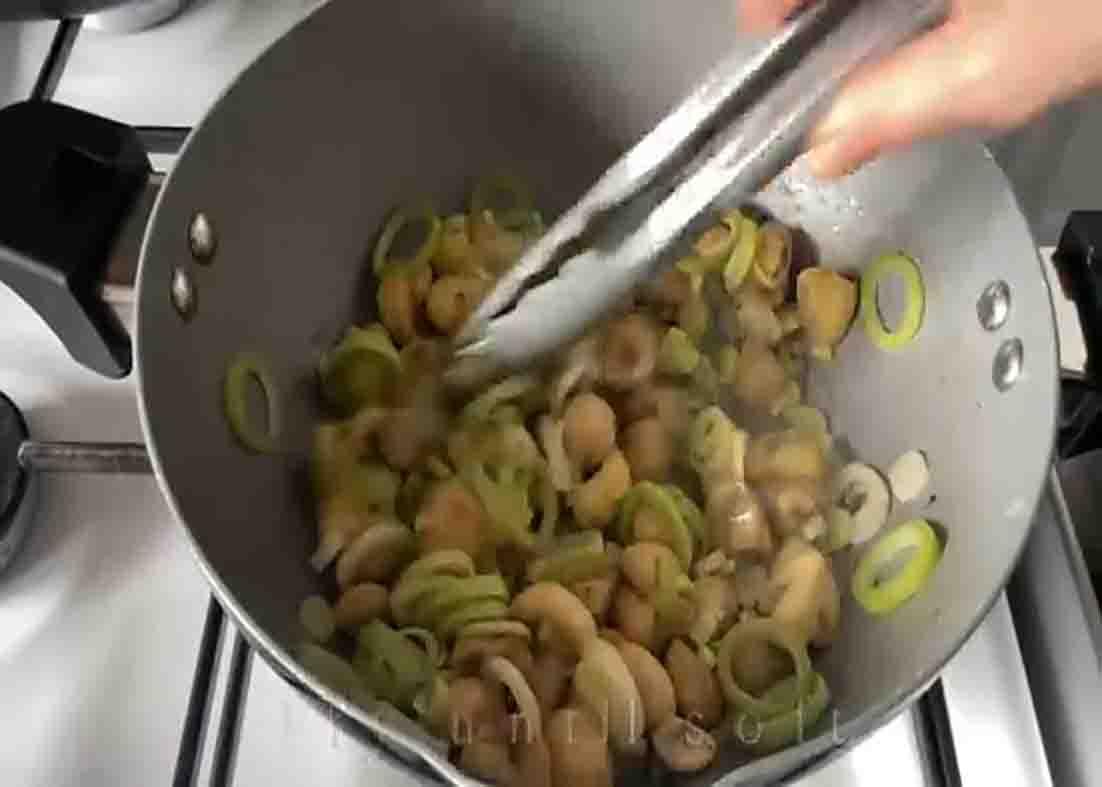 Sauteing the mushrooms and sliced green onions