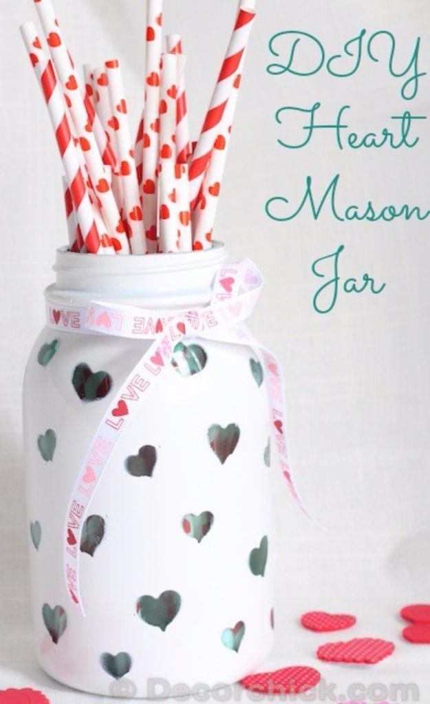 A painted mason jar with a clear heart shape showing through the paint, a cheap DIY Valentine gift idea