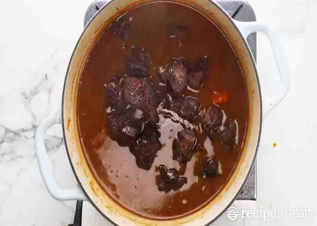 Combining all the ingredients for the beef bourguignon