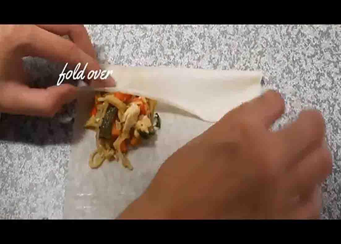Wrapping the chicken spring rolls