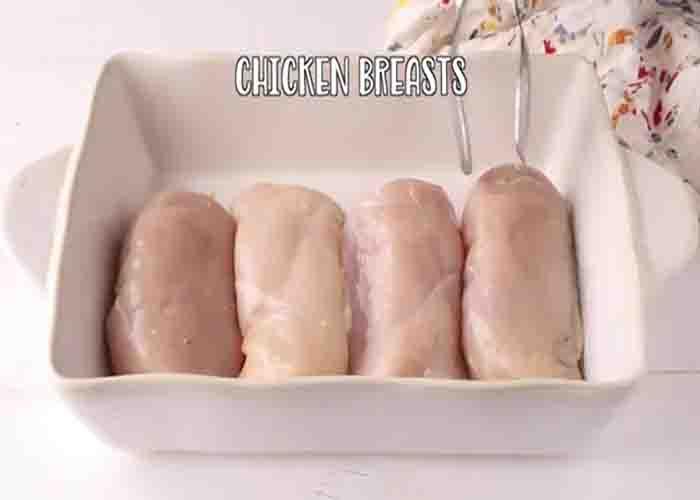 Placing the chicken breasts on the casserole dish
