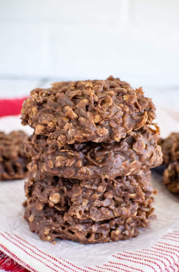 No bake Nutella cookies, four thick dark chocolate oat and coconut cookies stacked on a red striped cloth