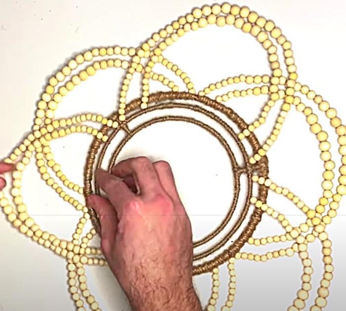 Attach Strands Of Beads With Copper Wire To A Dollar tree Wreath Form To make A Wood Bead Chandelier