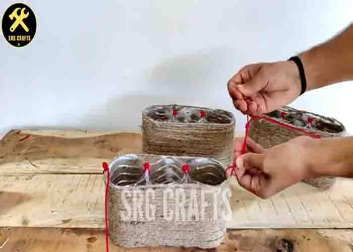 Adding the hang to the DIY hanging basket for plants