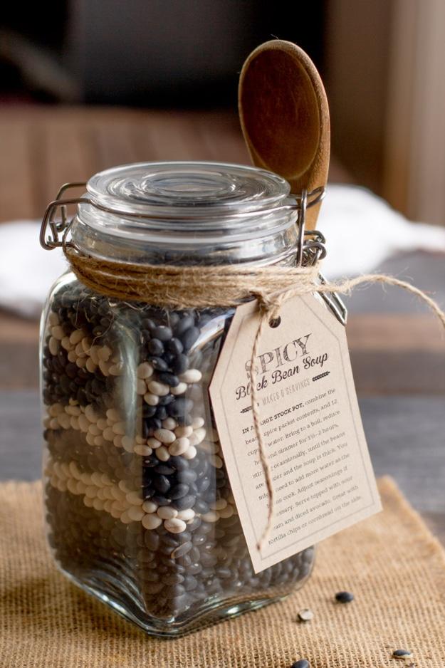 Spicy black bean soup in a jar with layered dried black and white beans and spices in a wide mouth quart jar