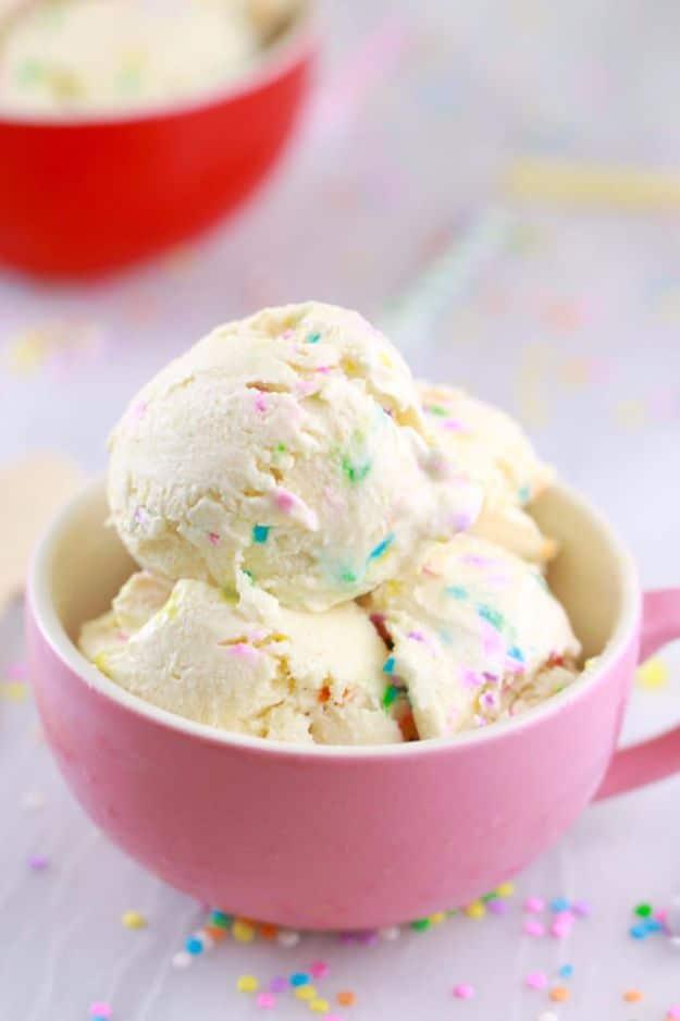 Cake batter frozen yogurt with rainbow sprinkles scooped into a bowl, an easy no churn five minute treat
