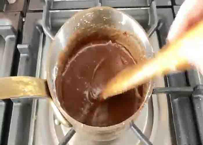 Making the frosting layer of the marshmallow brownie dessert