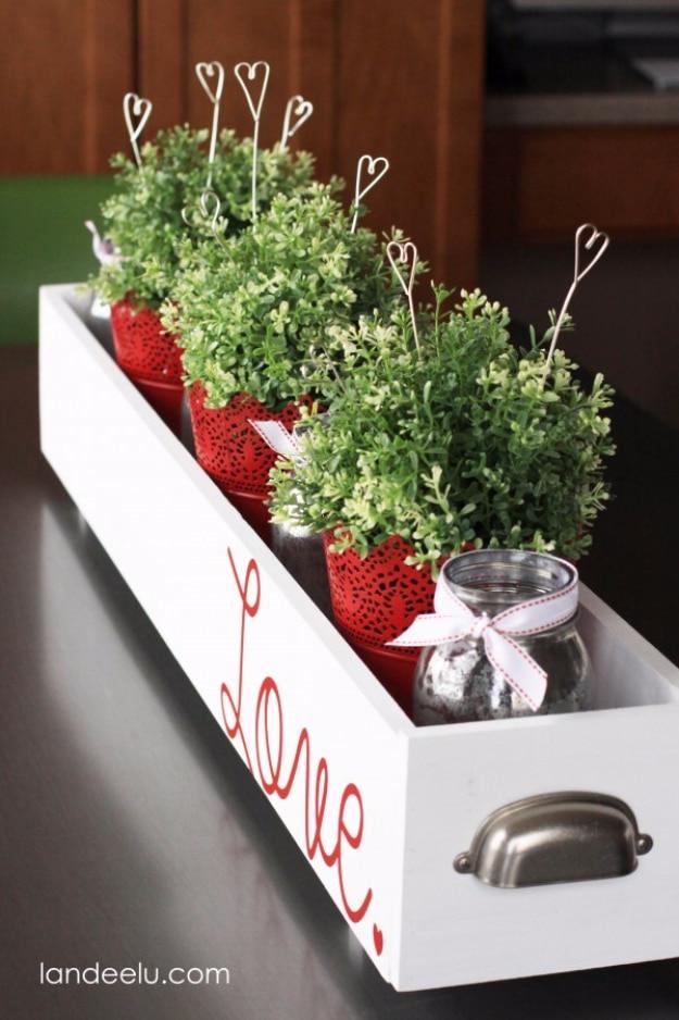 Twisted wire heart picks in a small vase, a quick DIY Valentine decor idea made from craft wire and pliers