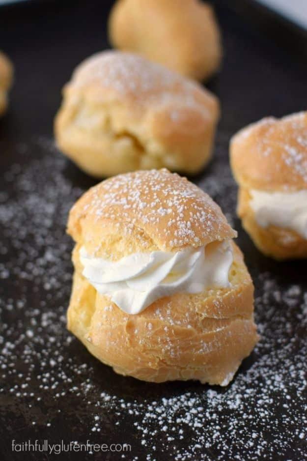 Gluten free cream puffs split open showing the crisp hollow shell ready for a whipped cream filling inside