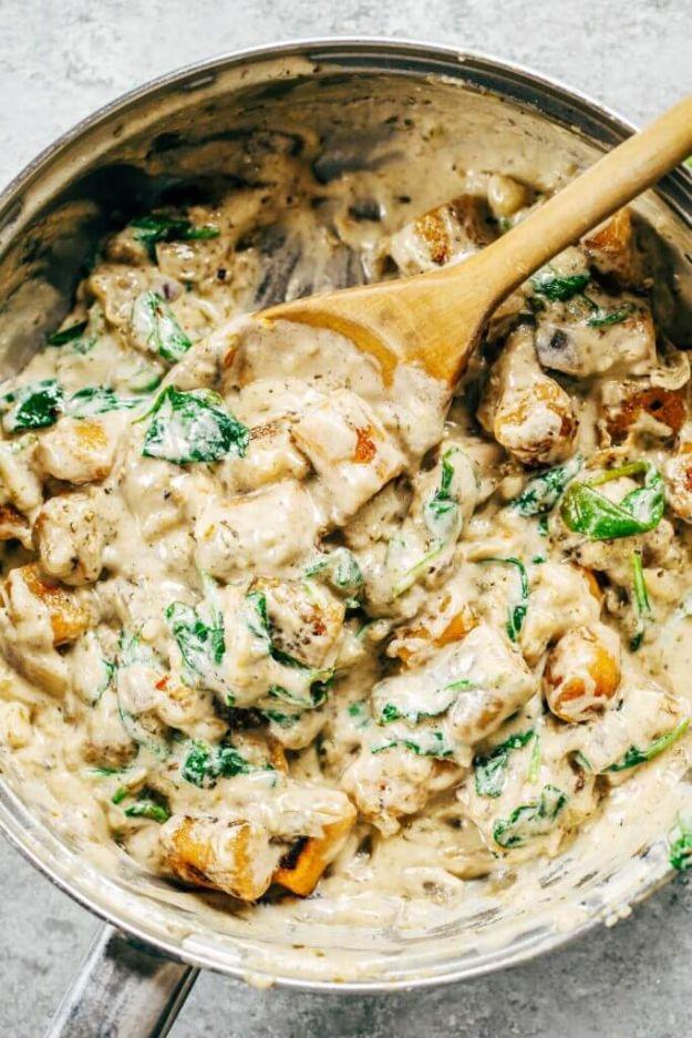 Sweet potato gnocchi simmered in a creamy spinach sauce for a cozy meatless dinner option for the whole family