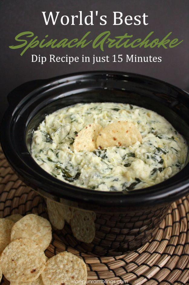 Best spinach artichoke dip served warm and cheesy in a white baking dish with sliced bread alongside