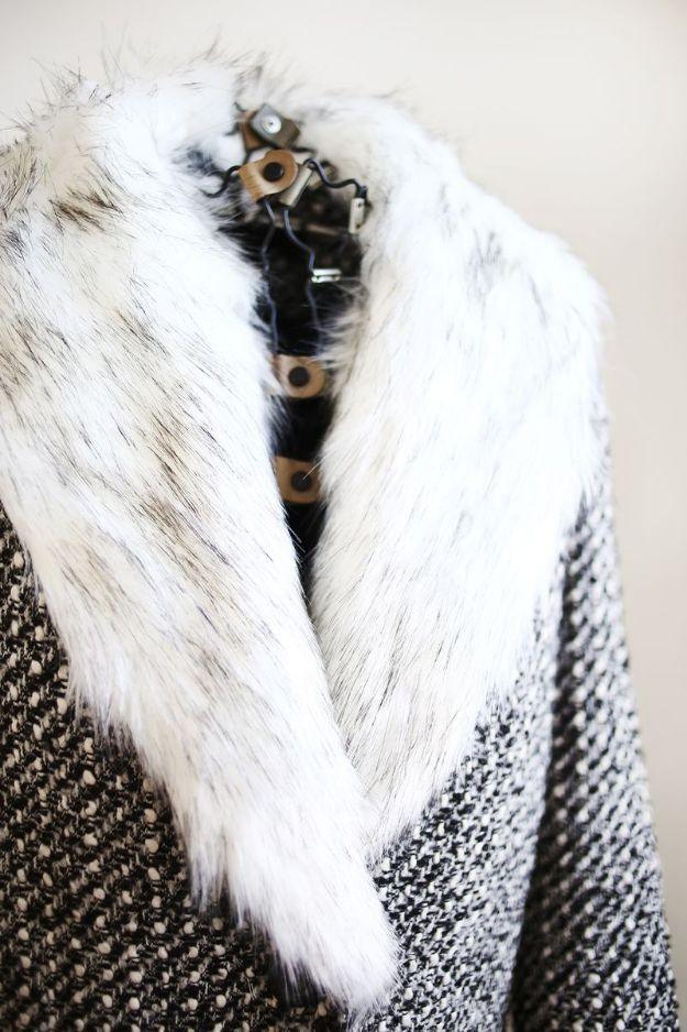 DIY clothes for winter, a white and grey faux fur collar buttoned onto a black and white tweed coat with wood buttons