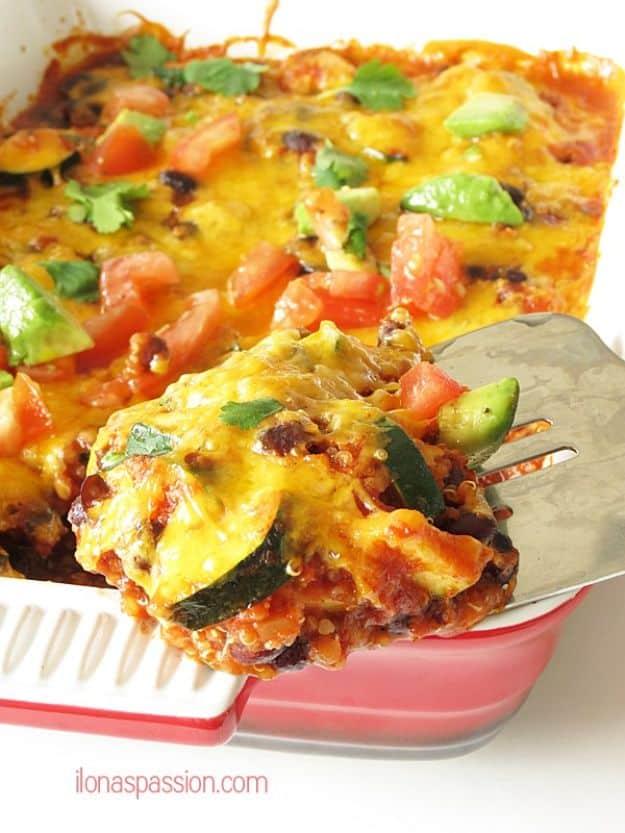 Taco zucchini quinoa casserole with browned cheddar on top, diced avocado, tomato and cilantro to finish