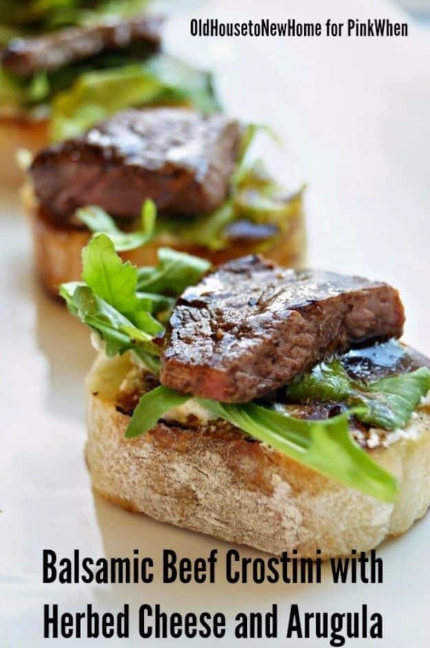 Balsamic beef crostini with herbed boursin cheese, arugula and sliced steak on toasted baguette rounds