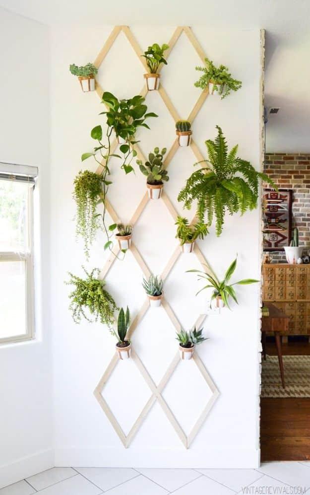 DIY Wood and Leather Trellis Plant Wall, easy to pull off with basic supplies and an idea worth saving for later