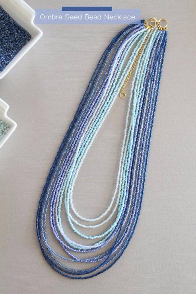 DIY ombre seed bead necklace, six graded strands of navy, mid blue, cream and white seed beads laid out flat