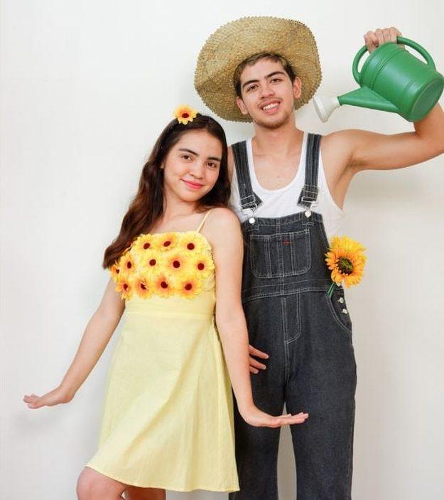 Couple dressed as a sunflower and gardener with yellow flower dress, denim overalls, straw hat and green watering can