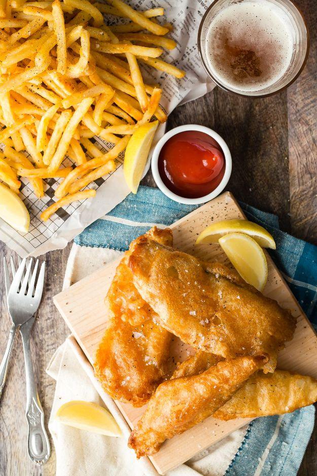 Crunchy beer battered tilapia fish and chips with lemon and tartar sauce, a classic fried fish recipe