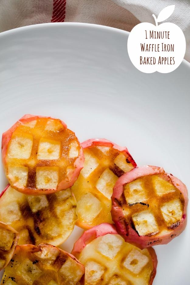 Apple rings cooked in a waffle iron for one minute, hot and soft and dusted with cinnamon sugar on a plate