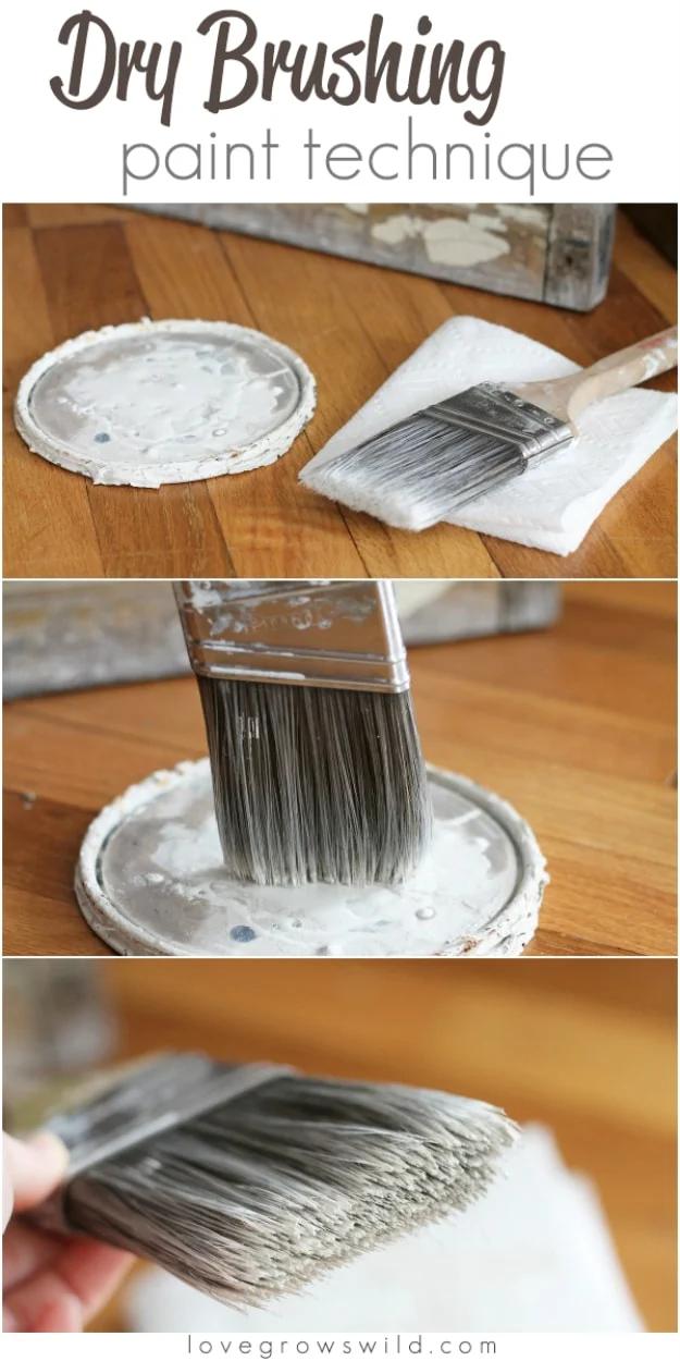 Dry brushing paint technique, a stiff brush loaded with white paint being offloaded on a paper towel over a tin lid
