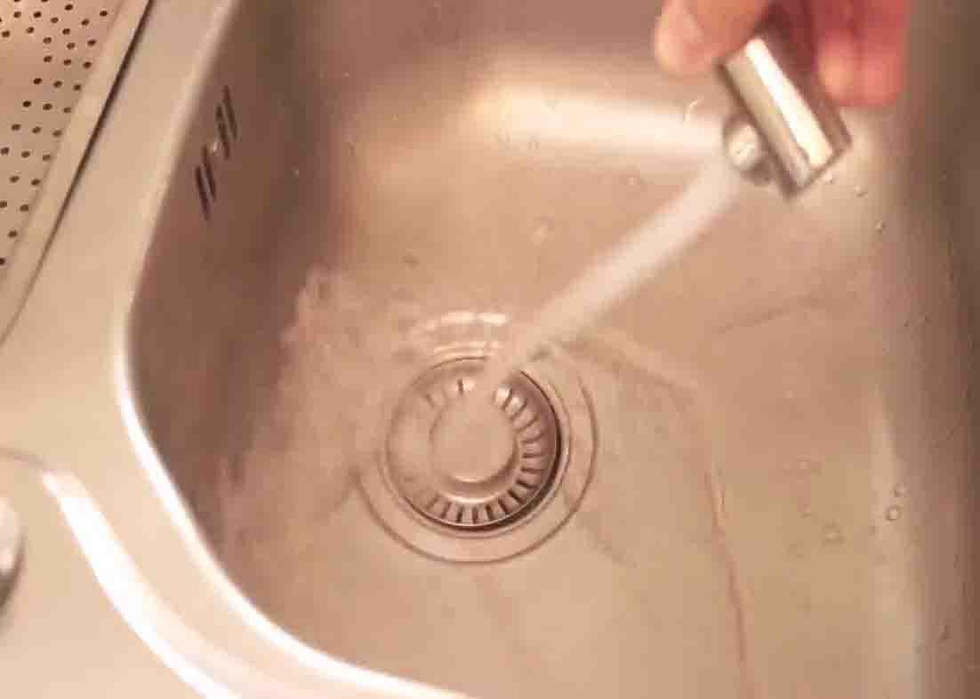 Rinsing the sinkhole with hot water