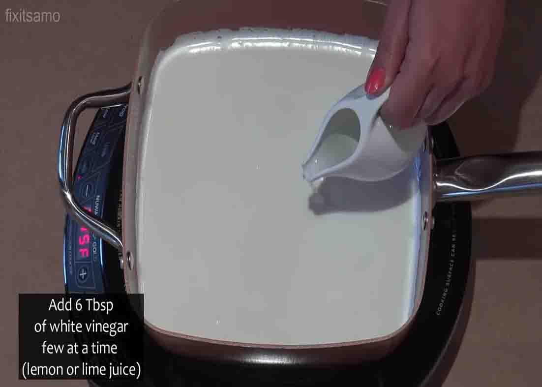 Adding the vinegar to the milk