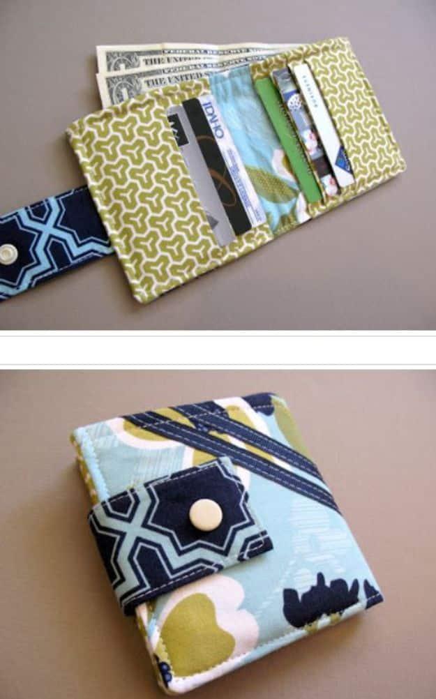 Bi-fold wallet, a blue and olive print wallet shown open with inward facing card slots above and closed on a snap tab below