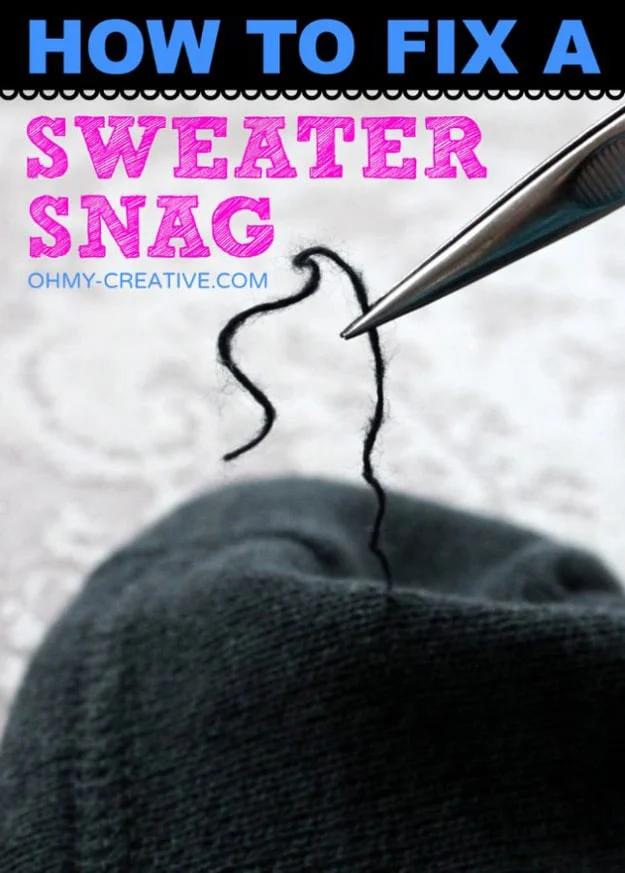 Clothing repair hack for sweaters, pointed tweezers lifting a long snagged loop of dark yarn from a gray knit