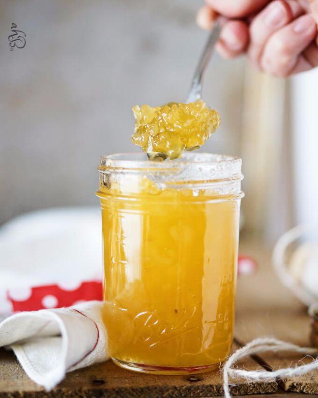 Pineapple jam in a small jar, bright golden and chunky, made from canned crushed pineapple and sugar