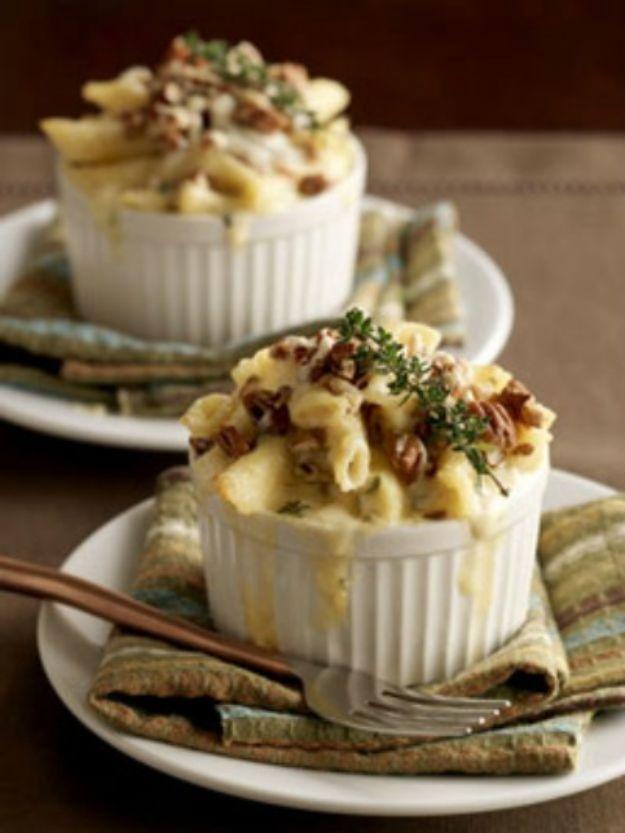 Bacon and black truffle macaroni and cheese baked in two small white ramekins with a browned panko cheese top