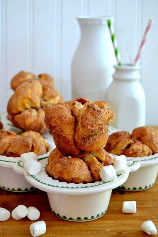 Monkey bread muffins made from canned biscuits with hollow caramel centers where the marshmallow melted