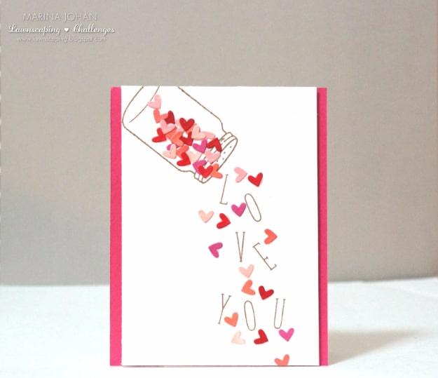 Falling die cut hearts Valentine card with pink and red hearts tumbling from a stamped jar down the front