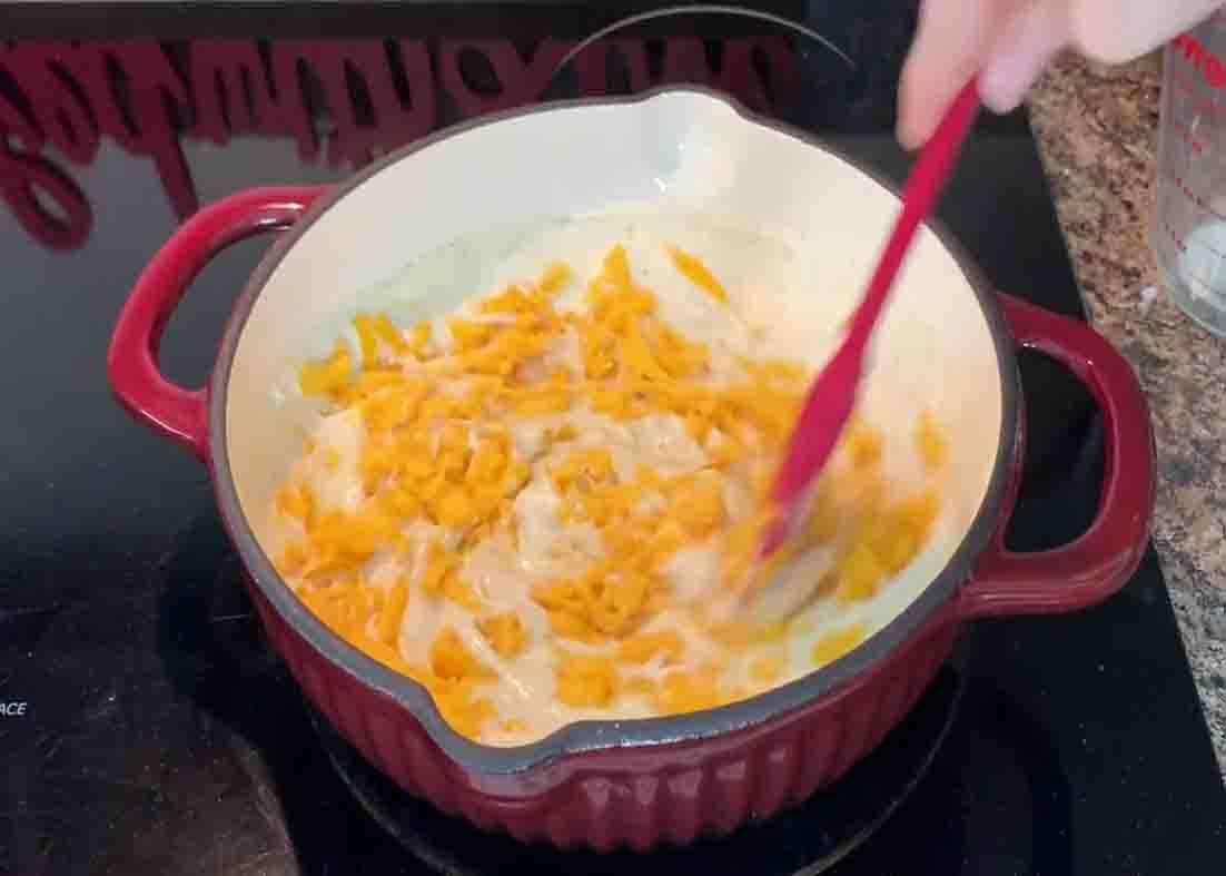 Combining all the ingredients for the mac and cheese sauce