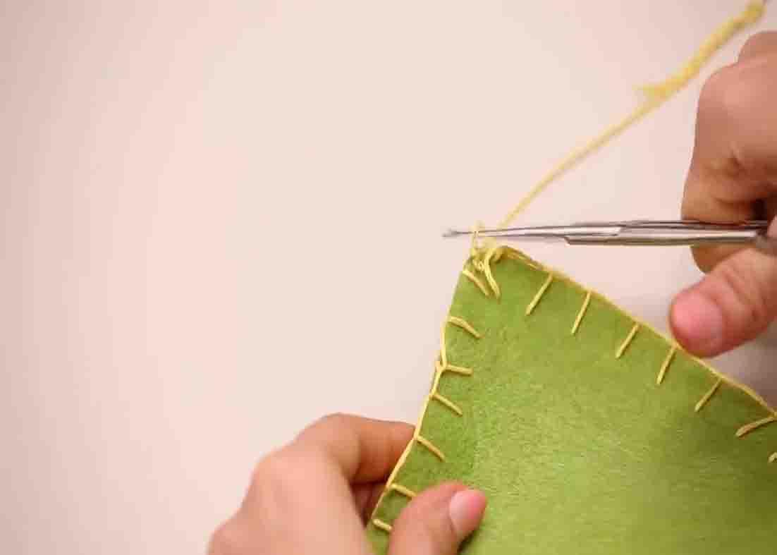 Stitching the edges of the gnome's hat