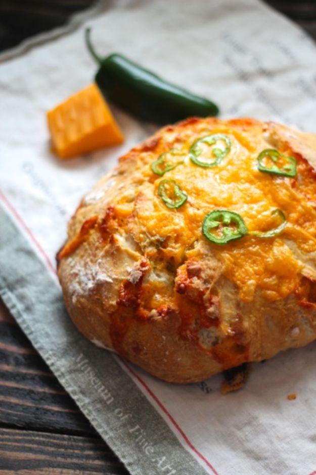 Jalapeno cheddar dutch oven bread with a crusty exterior and melted cheese worked all through the crumb