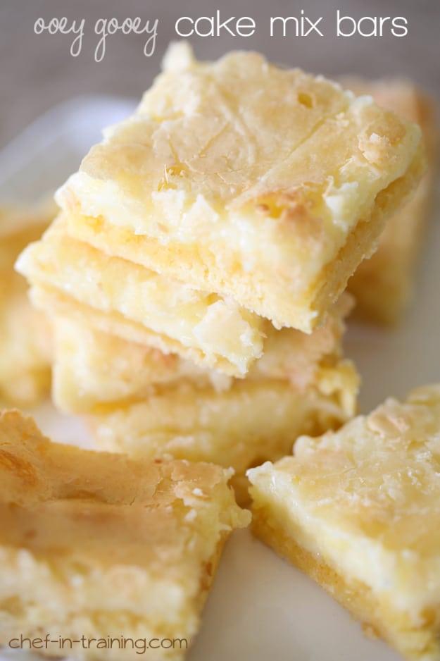 Ooey gooey cake mix bars cut into squares and dusted with powdered sugar, an easy last minute dessert idea