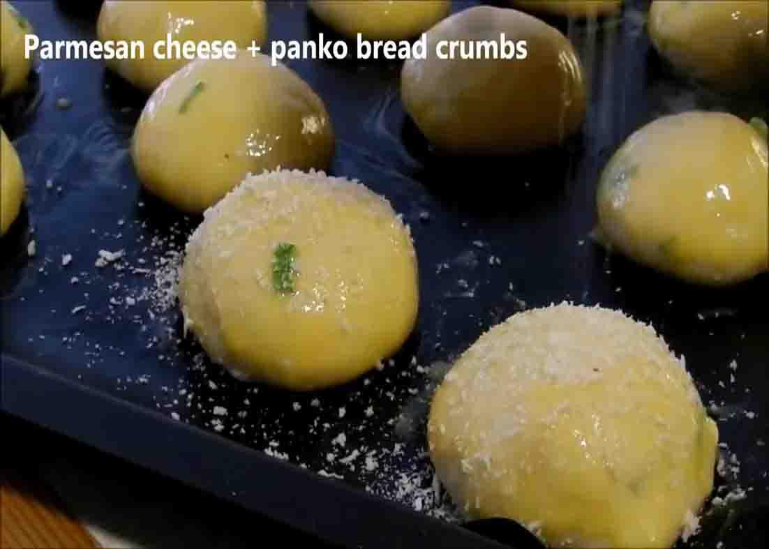 Sprinkling some panko breadcrumbs over the cheese balls