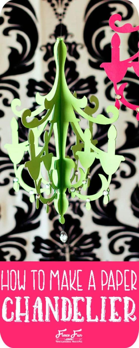 Typeset How to Make a Paper Chandelier title over a lime green cut paper chandelier on damask wallpaper