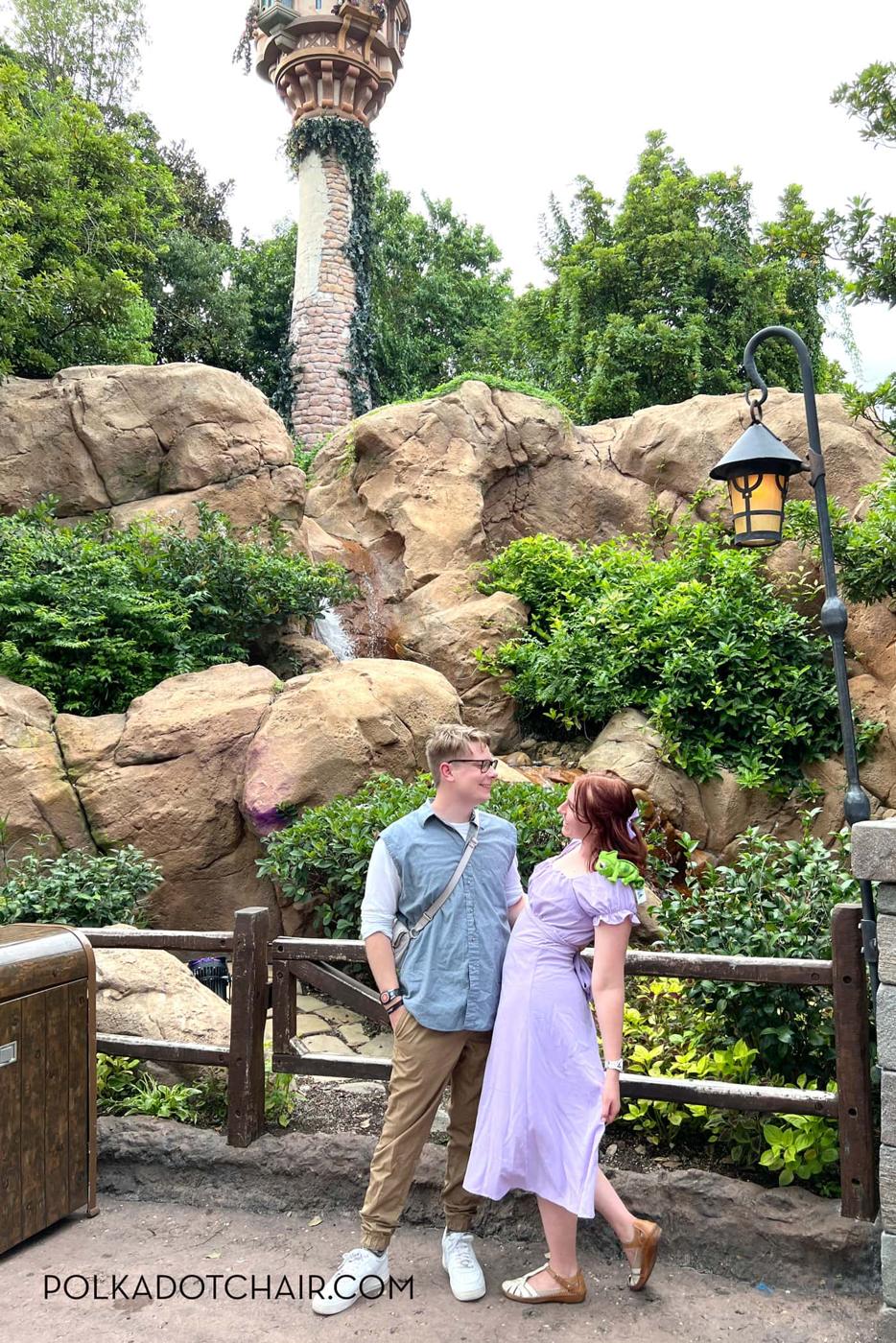 Rapunzel and Flynn Rider couples costume with a lavender ruffled dress, red wig, plush chameleon and a satchel