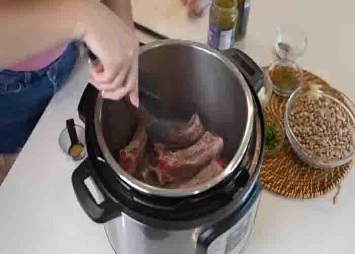 Cooking the ribs for the ribs and beans recipe