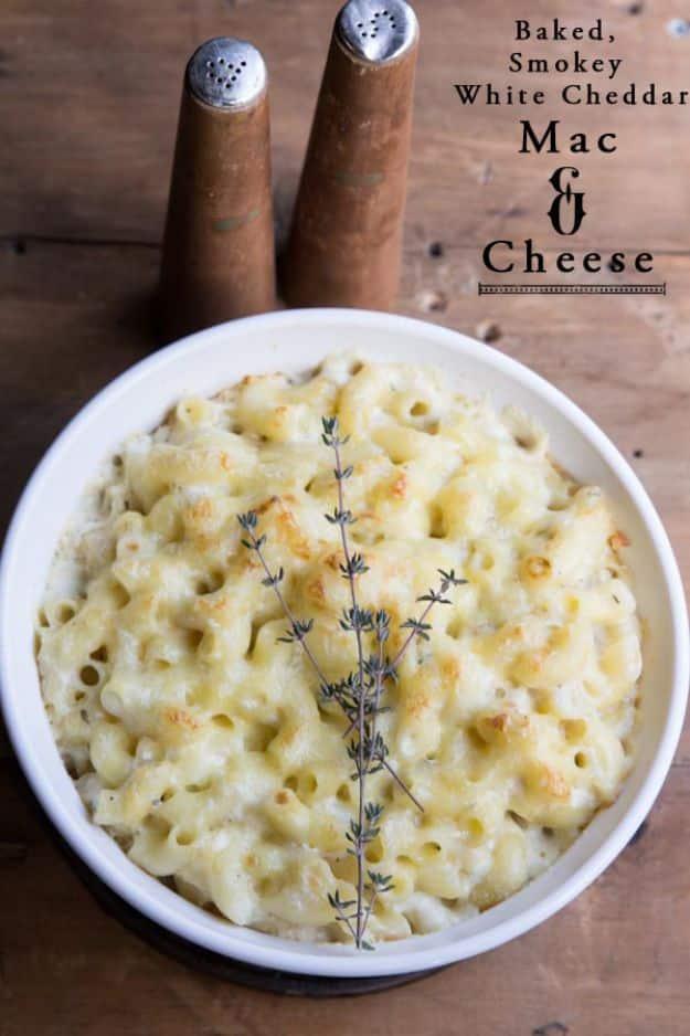Typeset graphic reading Baked Smokey White Cheddar Mac and Cheese over a white bowl of macaroni with thyme