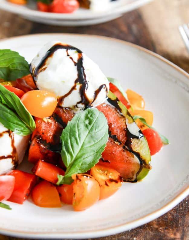 Honey grilled watermelon caprese salad with charred watermelon, mozzarella, tomatoes, basil and balsamic
