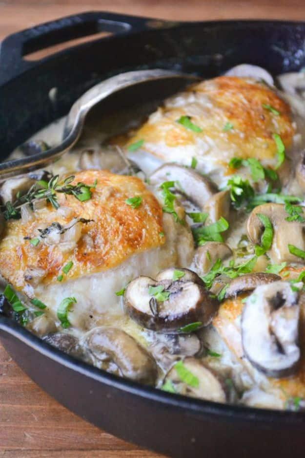 Chicken thighs marsala for two browned in a skillet with mushrooms and shallots in a creamy marsala sauce