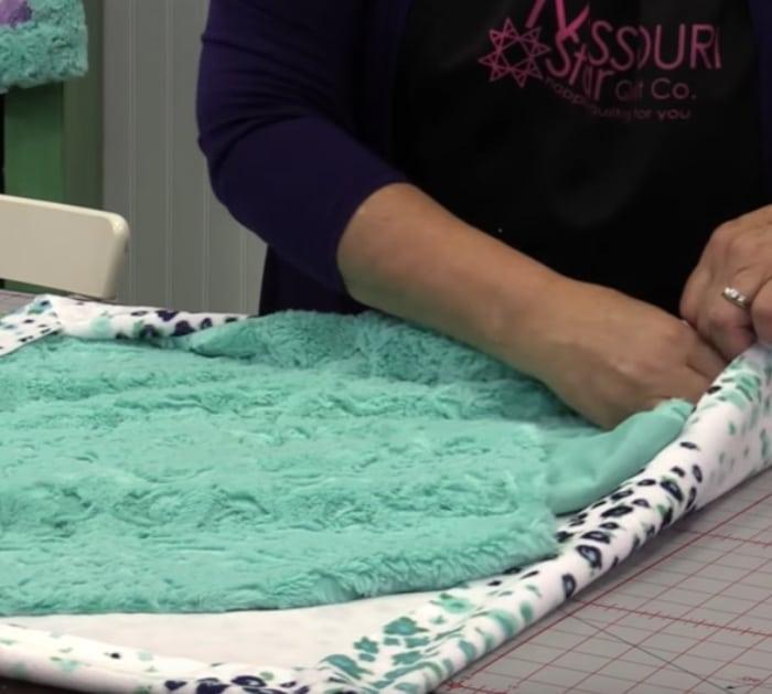 Make a baby blanket with soft and minky fabric that self binds