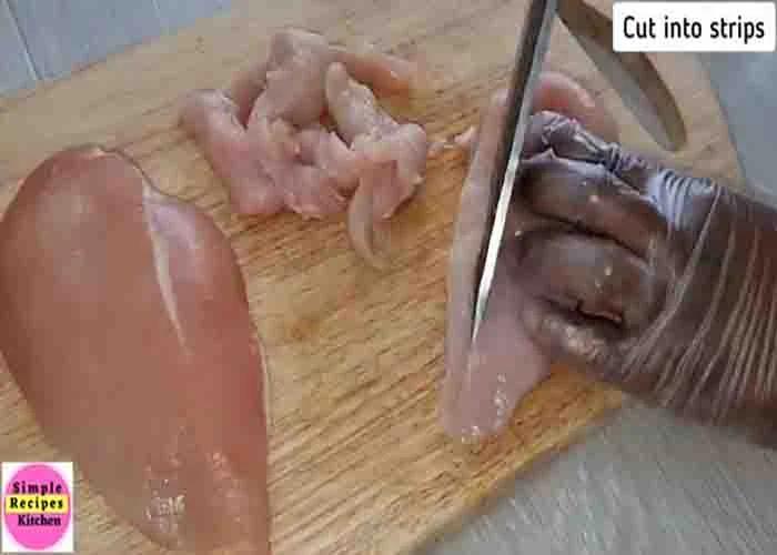 Cutting the chicken breasts into strips before air frying
